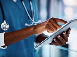 Cropped shot of a doctor using a digital tablet in a hospital